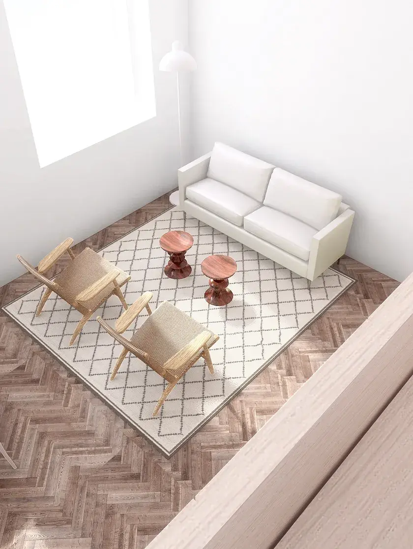A rendering of the view from a mezzanine overlooking an open concept living area with herringbone floors