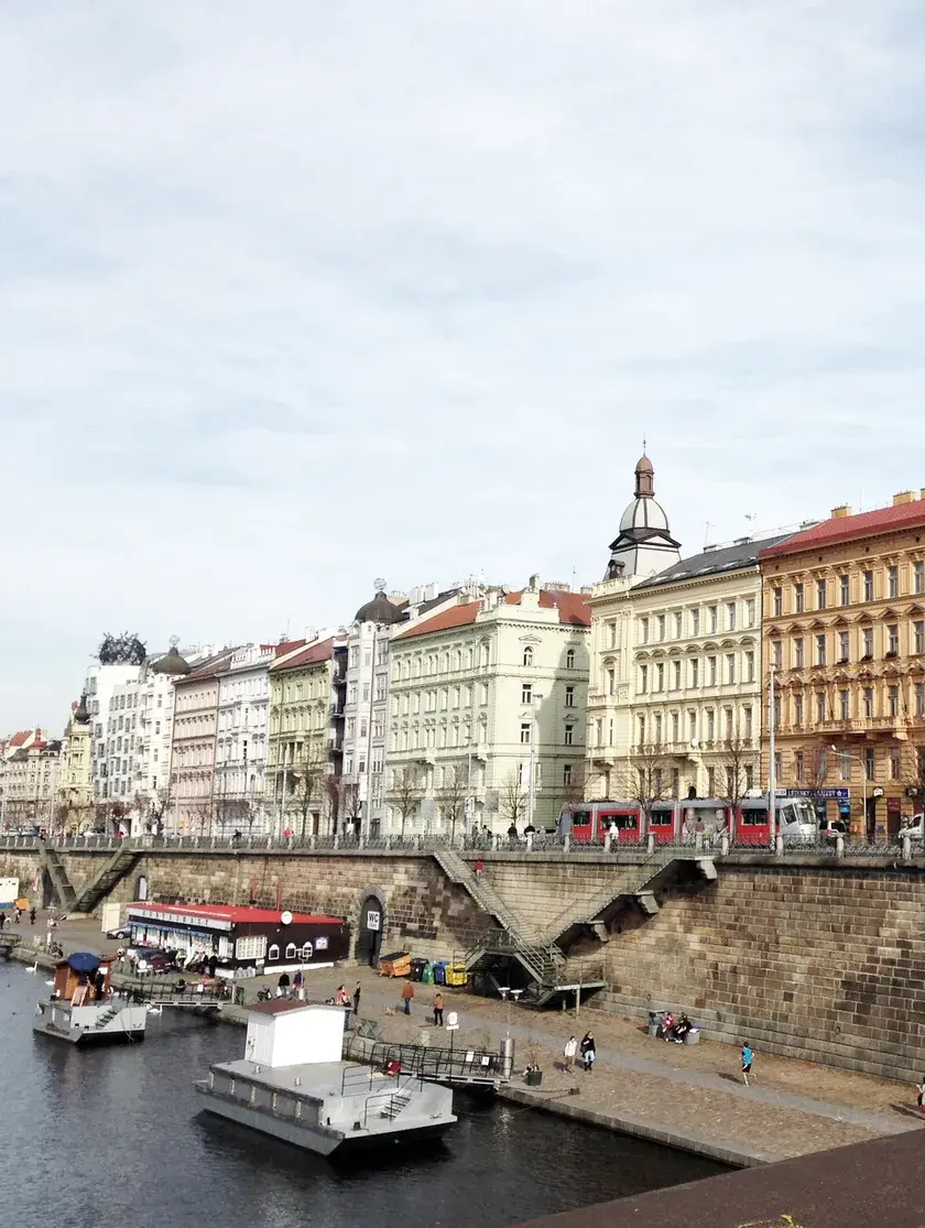 A line of neo-renaissance buildings overlooking the canal in Prague